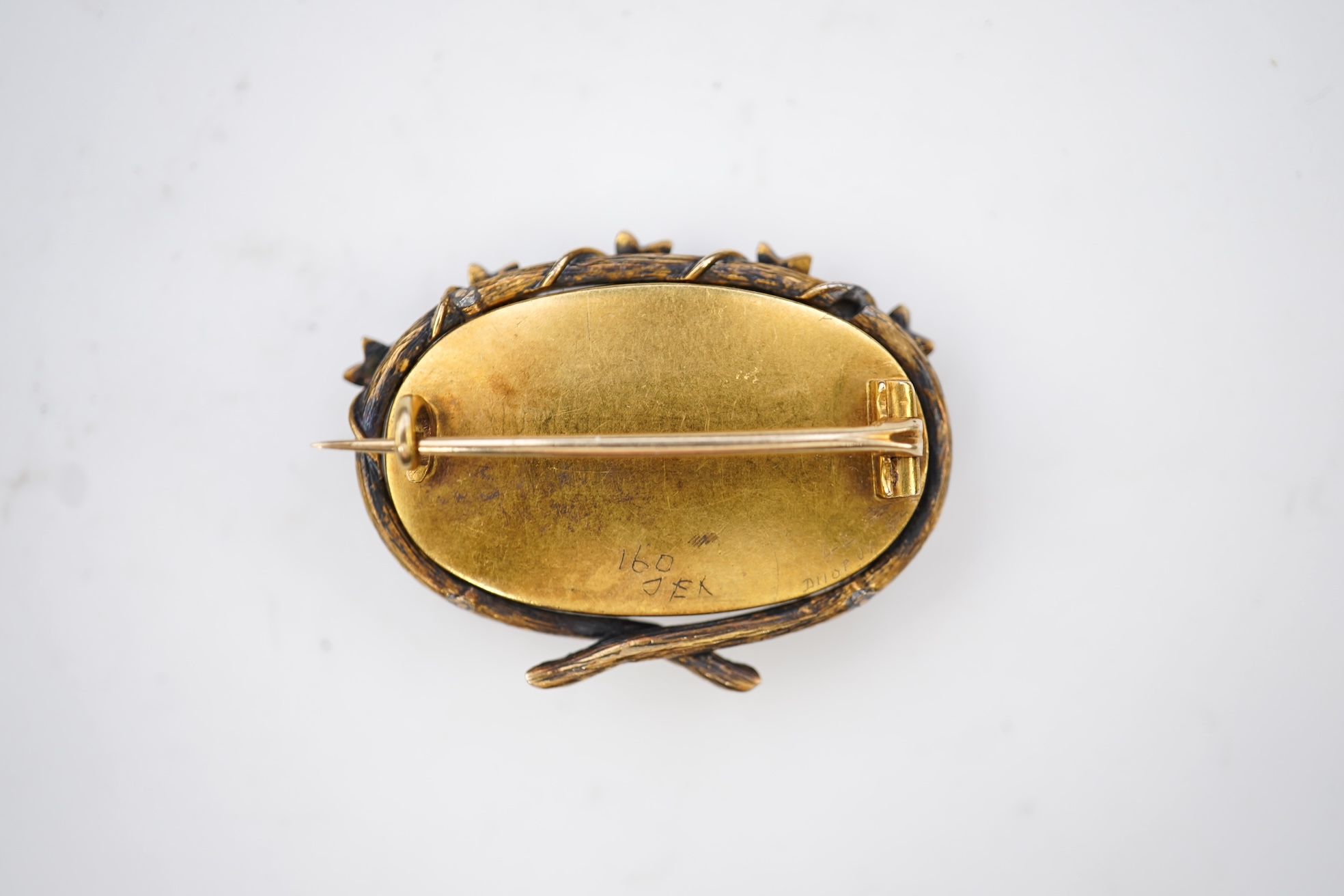 A reverse-carved and painted intaglio 'Essex crystal' brooch, late 19th century